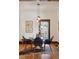 Charming dining room featuring hardwood floors, a glass-top table for six, and lovely artwork at 2771 W 38Th Ave, Denver, CO 80211