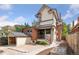 Back exterior showcasing patio, garden, and detached structure at 2771 W 38Th Ave, Denver, CO 80211