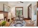 Living room featuring a fireplace, hardwood floors and a cozy sitting area at 2771 W 38Th Ave, Denver, CO 80211