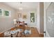 Bright home office featuring hardwood floors, a glass desk and comfortable chair at 2771 W 38Th Ave, Denver, CO 80211