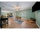Open basement area with laminate flooring, comfortable seating, and a foosball table at 8090 S Homesteader Dr, Morrison, CO 80465