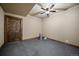 Finished basement area features a wooden door and rubber floors at 8090 S Homesteader Dr, Morrison, CO 80465