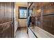 Bathroom features a glass shower, tiled walls, and wood frame at 8090 S Homesteader Dr, Morrison, CO 80465
