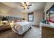 Bedroom with neutral walls, a queen size bed and a ceiling fan at 8090 S Homesteader Dr, Morrison, CO 80465