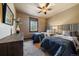 A comfortable bedroom with two twin beds, soft carpet, and neutral tones at 8090 S Homesteader Dr, Morrison, CO 80465