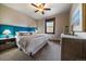 Bedroom with a neutral wall color, queen size bed, ceiling fan, and wooden dresser at 8090 S Homesteader Dr, Morrison, CO 80465