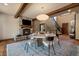 Cozy dining room featuring a stone fireplace and adjacent staircase at 8090 S Homesteader Dr, Morrison, CO 80465
