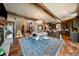 Open concept area that showcases the dining and kitchen area, hardwood floors and natural lighting at 8090 S Homesteader Dr, Morrison, CO 80465