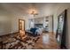 Inviting bedroom with hardwood floors, ceiling fan, walk-in closet, and comfortable seating for relaxation at 8090 S Homesteader Dr, Morrison, CO 80465