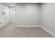 Finished basement featuring neutral carpet, white walls, and ample space for various uses at 3875 E 4Th Ave # 2, Denver, CO 80206