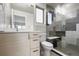 This full bathroom features a shower with a glass door, modern cabinets and a sleek design at 3875 E 4Th Ave # 2, Denver, CO 80206