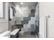 Stylish bathroom featuring glass-enclosed shower and eye-catching gray-toned tile design at 3875 E 4Th Ave # 2, Denver, CO 80206