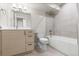 Bright bathroom with modern vanity, tile flooring, and a bathtub with shower at 3875 E 4Th Ave # 2, Denver, CO 80206