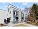 Modern townhouse exterior showcasing stylish architecture and well-maintained landscaping on a sunny day at 3875 E 4Th Ave # 2, Denver, CO 80206