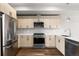 Well-equipped kitchen featuring stainless steel appliances, modern cabinets, and a stylish backsplash at 3875 E 4Th Ave # 2, Denver, CO 80206