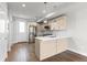 Modern kitchen with light wood cabinets, stainless steel appliances, and a functional kitchen island at 3875 E 4Th Ave # 2, Denver, CO 80206