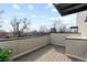 Serene outdoor patio space offering city views surrounded by gray privacy walls at 3875 E 4Th Ave # 2, Denver, CO 80206