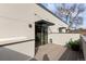 Inviting patio with a sliding glass door with gray privacy walls and an outdoor hose at 3875 E 4Th Ave # 2, Denver, CO 80206