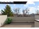 Tranquil outdoor patio space with serene city views and planter full of foliage at 3875 E 4Th Ave # 2, Denver, CO 80206