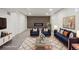 Cozy basement living room featuring modern decor, including a decorative fireplace and plush seating at 6068 Lee St, Arvada, CO 80004
