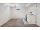 Finished basement featuring neutral carpet, a wet bar, and ample space for entertainment at 6068 Lee St, Arvada, CO 80004