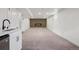 Spacious carpeted basement area with a wet bar, adding a touch of luxury and convenience at 6068 Lee St, Arvada, CO 80004