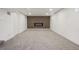 Finished basement featuring a spacious rec area with carpet and a decorative wall-mounted TV at 6068 Lee St, Arvada, CO 80004