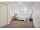 Cozy bedroom with carpet, comfortable queen bed, side table and a window at 6068 Lee St, Arvada, CO 80004