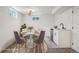 Basement dining area featuring modern decor with a small kitchenette and bright lighting at 6068 Lee St, Arvada, CO 80004