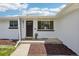 A freshly painted home features a welcoming front door and meticulously maintained landscaping at 6068 Lee St, Arvada, CO 80004