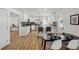 Modern kitchen featuring stainless steel appliances, sleek cabinetry, and an eat-in island at 6068 Lee St, Arvada, CO 80004
