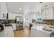 Modern kitchen with white cabinets, stainless steel appliances, and a quartz countertop at 6068 Lee St, Arvada, CO 80004