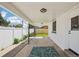 Covered patio area with a concrete floor, white pillars, and a view of the yard at 6068 Lee St, Arvada, CO 80004
