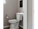 Cozy half-bathroom features a pedestal sink, toilet, and neutral paint at 640 E Fremont Pl, Littleton, CO 80122