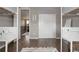 Bright bedroom with hardwood floors, featuring a closet, view to an open doorway, and stylish decor at 640 E Fremont Pl, Littleton, CO 80122