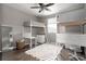 Bright bedroom featuring stylish bunk beds with desk space, a modern ceiling fan, and a colorful decorative rug at 640 E Fremont Pl, Littleton, CO 80122