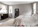 Bright bedroom with beautiful hardwood floors, lots of natural light, and stylish furnishings at 640 E Fremont Pl, Littleton, CO 80122
