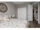 Comfortable bedroom offers natural light, closet access, and ensuite bathroom at 640 E Fremont Pl, Littleton, CO 80122