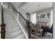 Bright dining area next to staircase with a wooden table and views of the stairs at 640 E Fremont Pl, Littleton, CO 80122