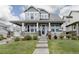 Charming two-story home with a welcoming front porch and well-manicured lawn at 640 E Fremont Pl, Littleton, CO 80122