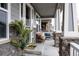 Inviting front porch with comfortable seating, perfect for relaxing outdoors at 640 E Fremont Pl, Littleton, CO 80122