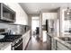Beautiful kitchen featuring granite countertops, stainless steel appliances, and a stylish backsplash at 640 E Fremont Pl, Littleton, CO 80122
