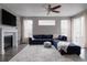 Spacious living room with a comfortable sofa, fireplace, and large windows at 640 E Fremont Pl, Littleton, CO 80122