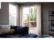 Comfortable living area with a sliding glass door and a view of the private fenced yard at 640 E Fremont Pl, Littleton, CO 80122