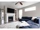 Cozy living room featuring a fireplace, built-in shelves, and comfortable seating at 640 E Fremont Pl, Littleton, CO 80122