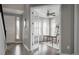 Inviting home office featuring natural light, desk, chair, decor, and glass paneled door at 640 E Fremont Pl, Littleton, CO 80122