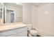 Clean bathroom with white vanity, tile surround tub, and modern fixtures at 16203 E 47Th Pl, Denver, CO 80239