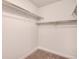 Spacious walk-in closet with ample shelving, perfect for organization at 16203 E 47Th Pl, Denver, CO 80239