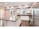 A kitchen featuring an island with granite countertops and stainless steel appliances at 16203 E 47Th Pl, Denver, CO 80239