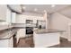 A kitchen with granite countertops, an island and stainless steel appliances at 16203 E 47Th Pl, Denver, CO 80239